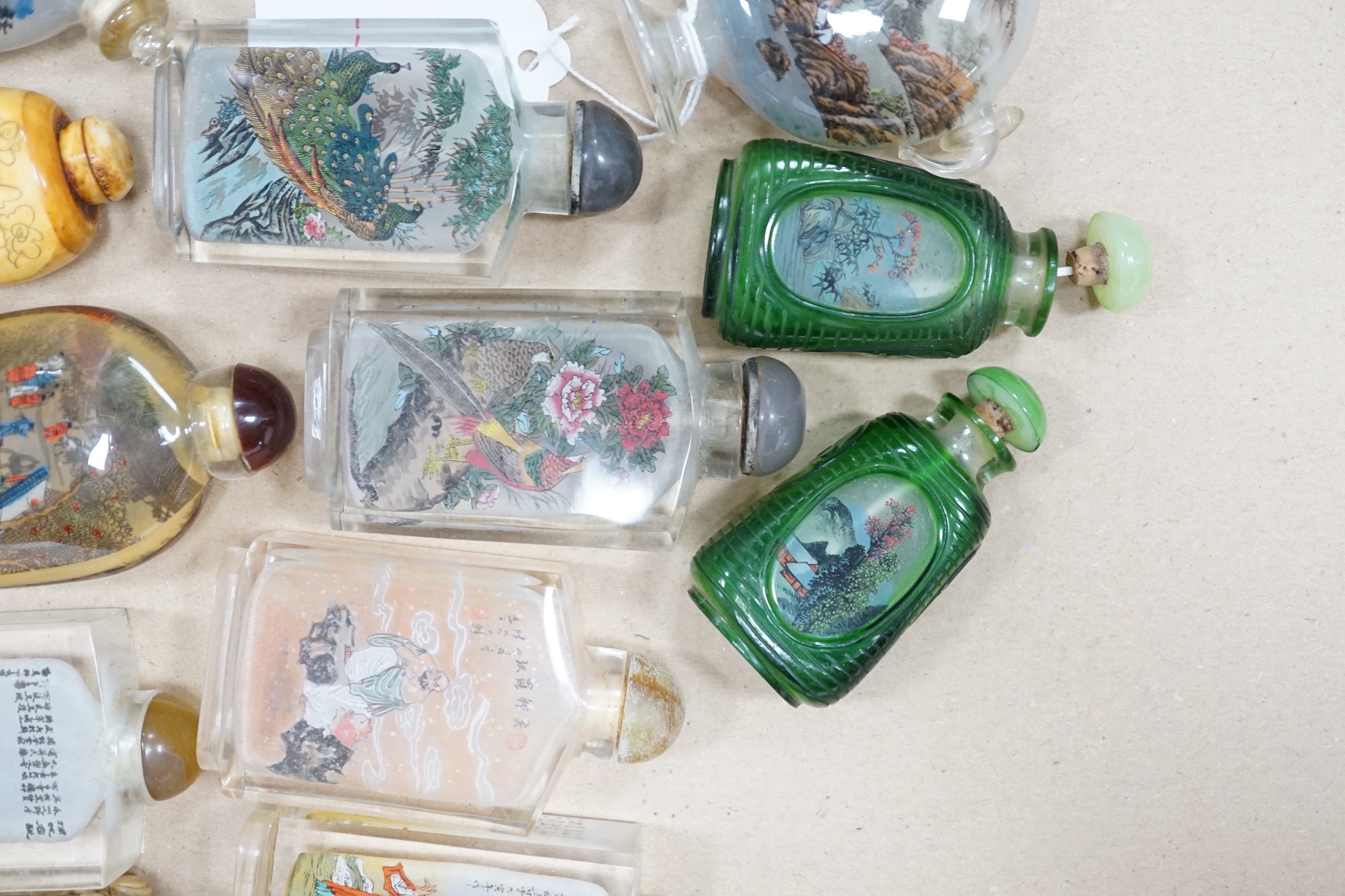 A collection of Chinese snuff bottles, mostly reverse painted (2 trays)